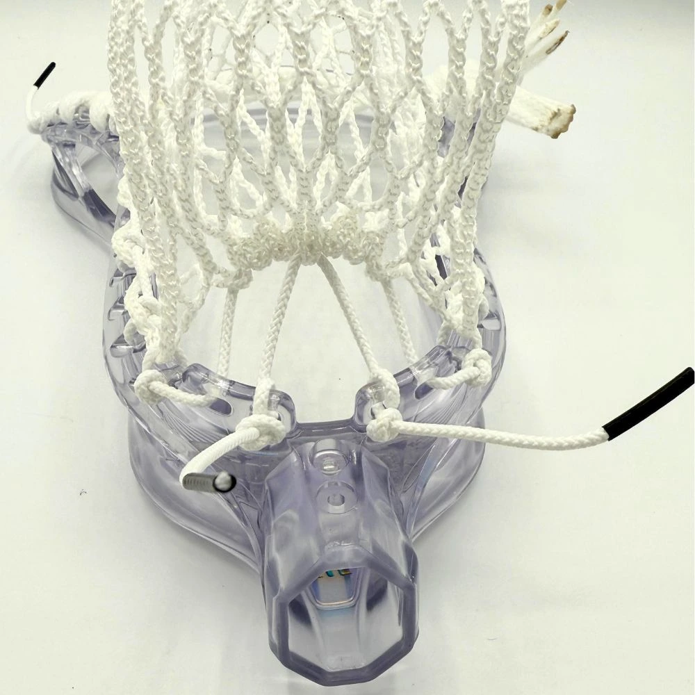 clear stx stallion prism lacrosse head strung with all white hero 4.0 semi-soft mesh and white strings.