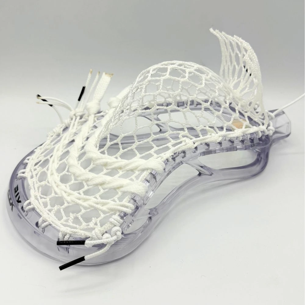 clear stx stallion prism lacrosse head strung with all white hero 4.0 semi-soft mesh and white strings.