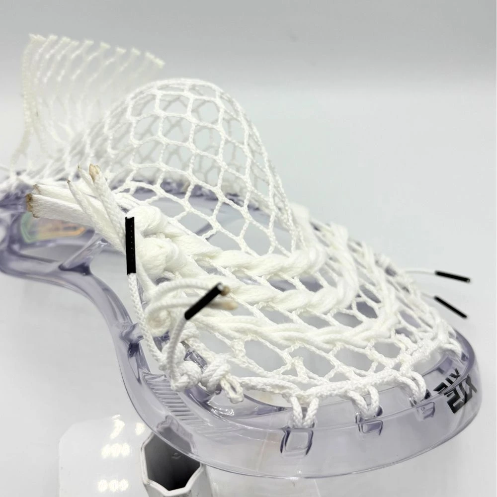 clear stx stallion prism lacrosse head strung with all white hero 4.0 semi-soft mesh and white strings.