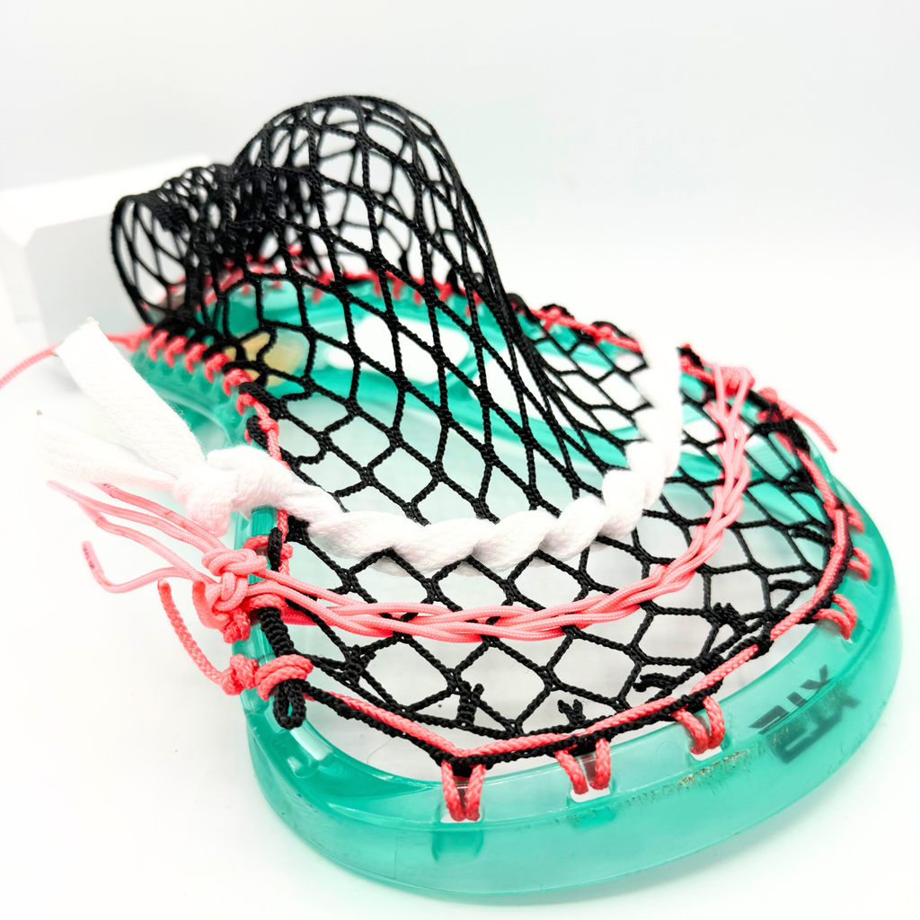 rear angle of teal stx stallion prism head strung with black mesh, white lace shooter, and coral pink shooting strings