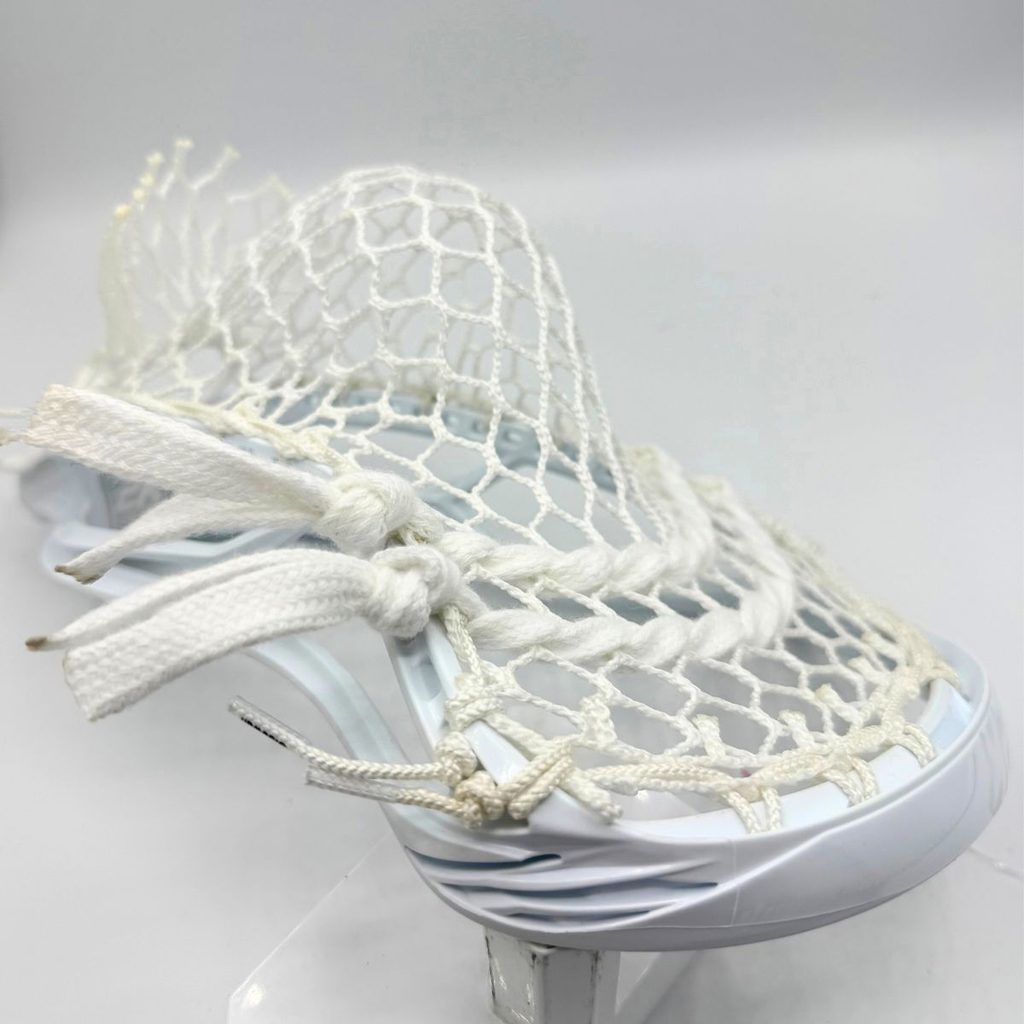 allwhite stx surgeon 2k head strung with ecd hero 4.0 semisoft mesh, white sidewall, and two white lace shooters