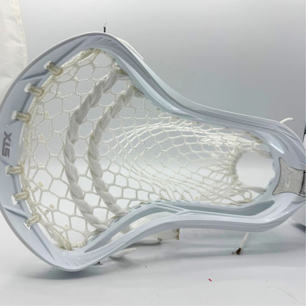 top view of allwhite stx surgeon 2k mid pocket with ecd hero 4.0 semisoft mesh and two white lace shooters