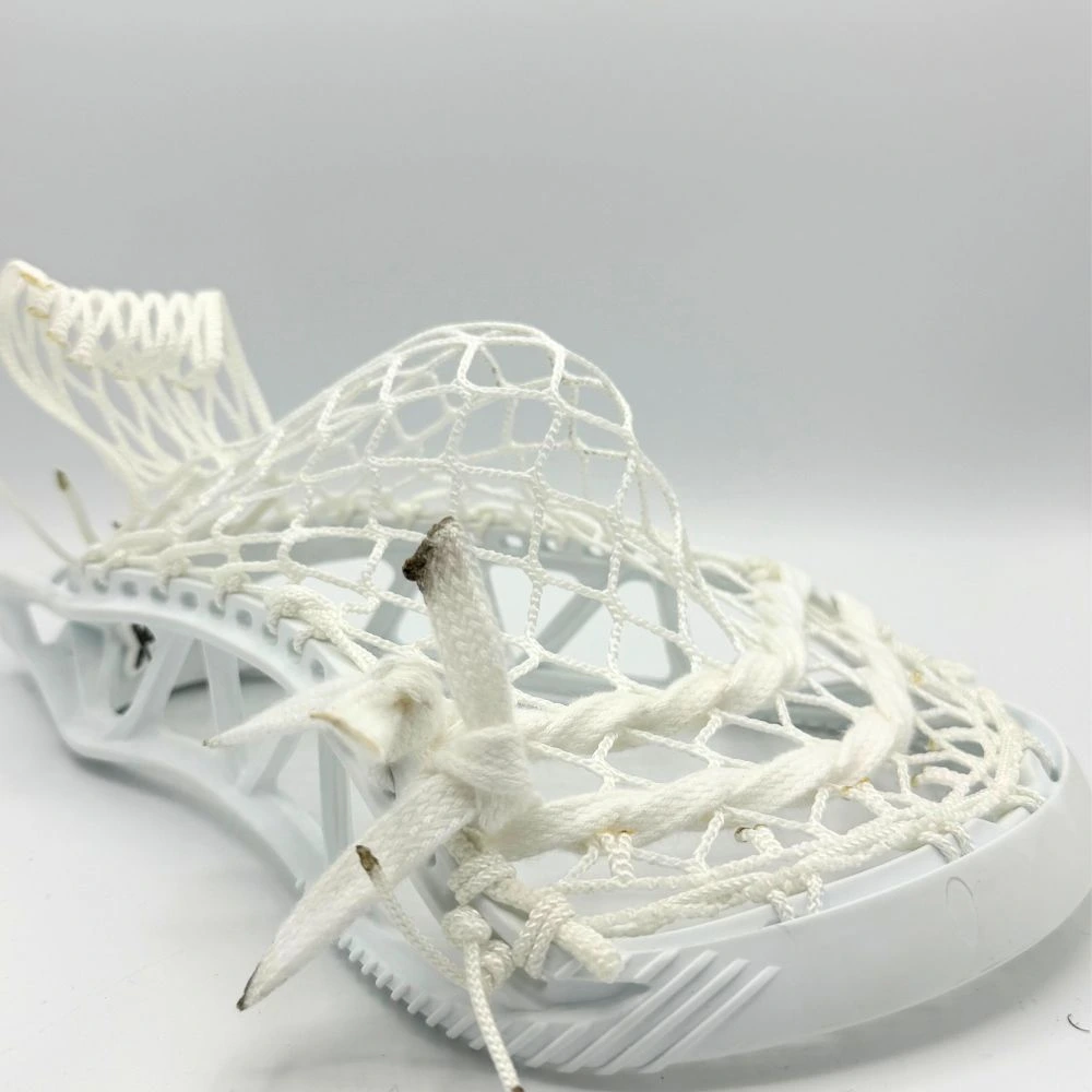 Left sidewall view of STX X20 strung with white 8 diamond mesh in a mid-high pocket