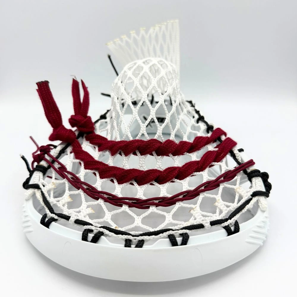 white stx x20 lacrosse head center channel view with stringers shack 10 diamond lacrosse mesh, a mid pocket, and maroon lacrosse shooting strings and cords