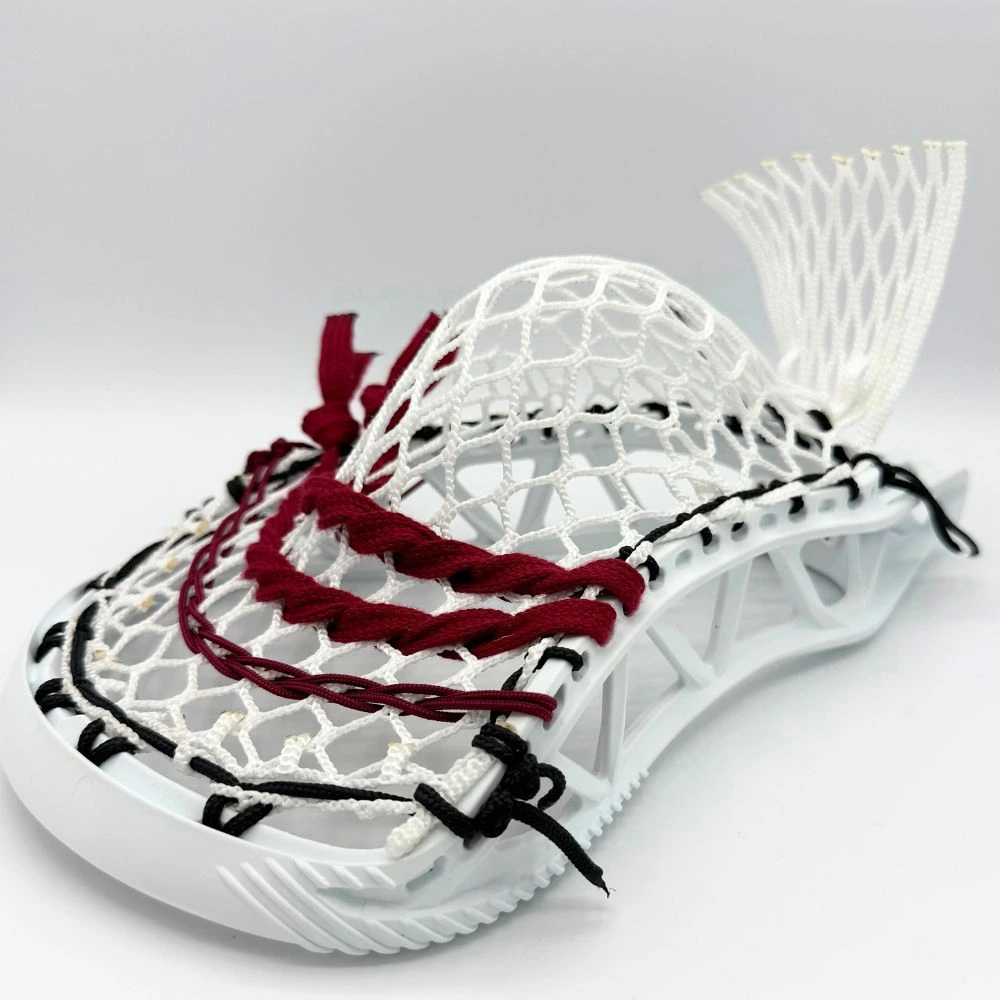 white stx x20 lacrosse head right channel view with stringers shack 10 diamond lacrosse mesh, a mid pocket, and maroon lacrosse shooting strings and cords