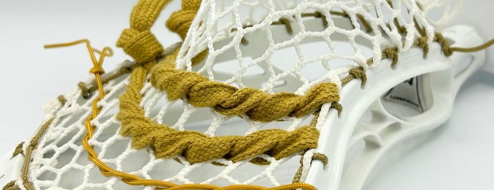 lacrosse stick head strung with mid pocket, suitable for all skill levels and versatile playing styles. lacrosse head is warrior evolyte unstrung ($50). mesh is ecd hero 3.0 semi-hard ($24.99). sidewall is laxroom vegas gold lacrosse sidewall (3-pack) ($1.14). shooters are laxroom vegas gold shooters ($1.82). shooting cord is laxroom lacrosse shooting cord (vegas gold) ($1.00). total cost is $98.95