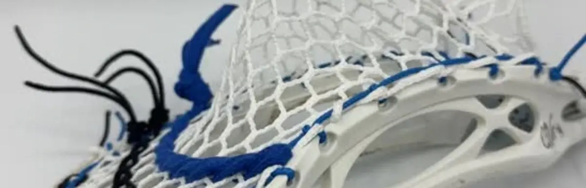 Custom strung Warrior Mojo lacrosse head with Hero 4.0 Semi-Soft mesh featuring a mid-pocket for men's league midfielders.