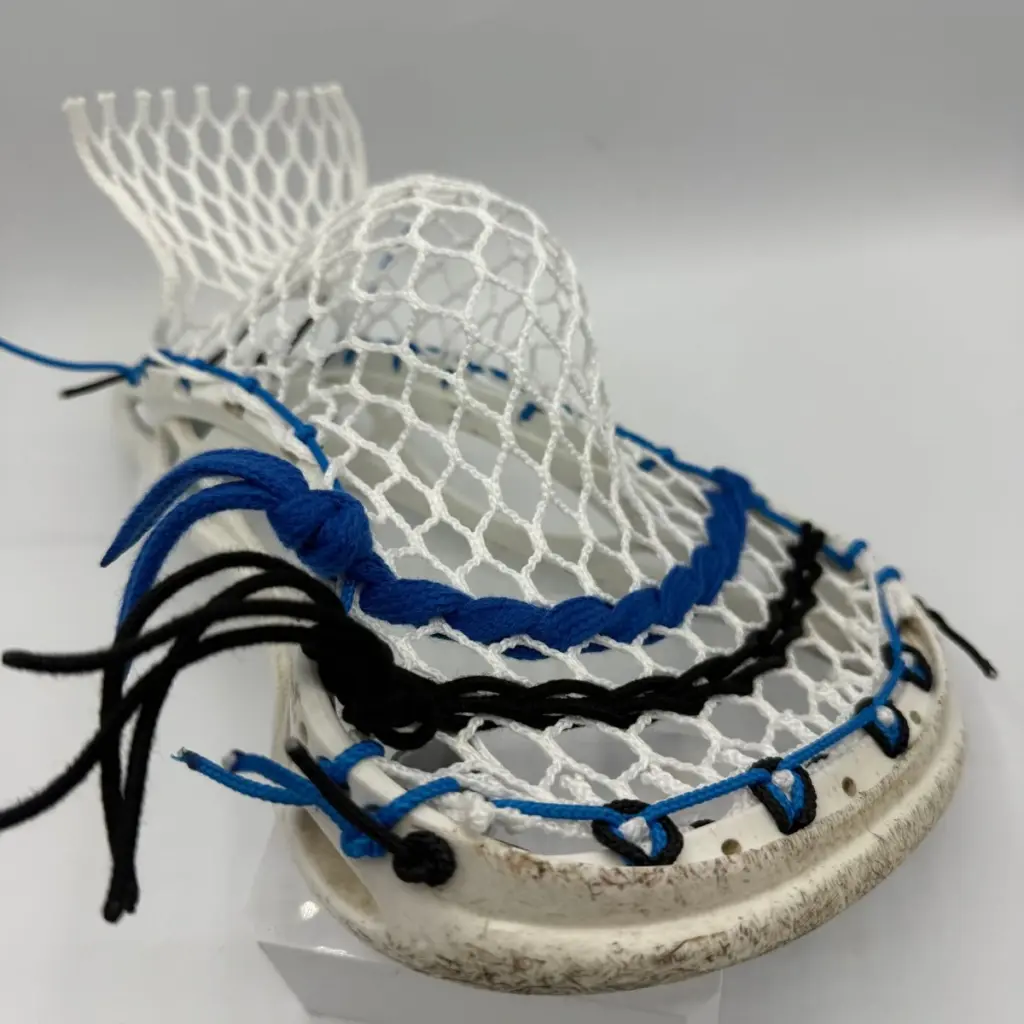 Custom strung Warrior Mojo lacrosse head with Hero 4.0 Semi-Soft mesh featuring a mid-pocket for men's league midfielders.