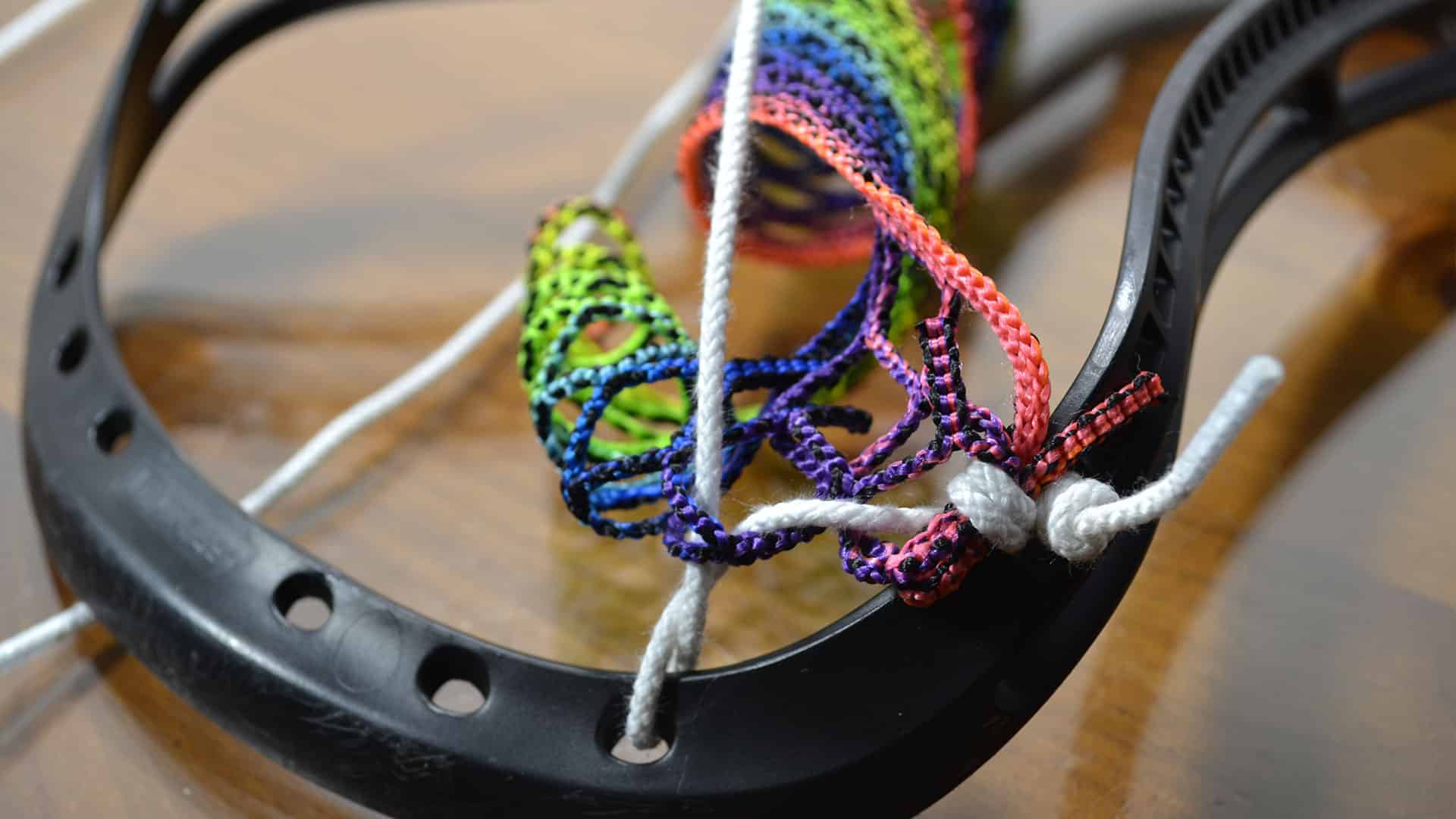 How to String a Women's Lacrosse Head womens lacrosse top string step 2