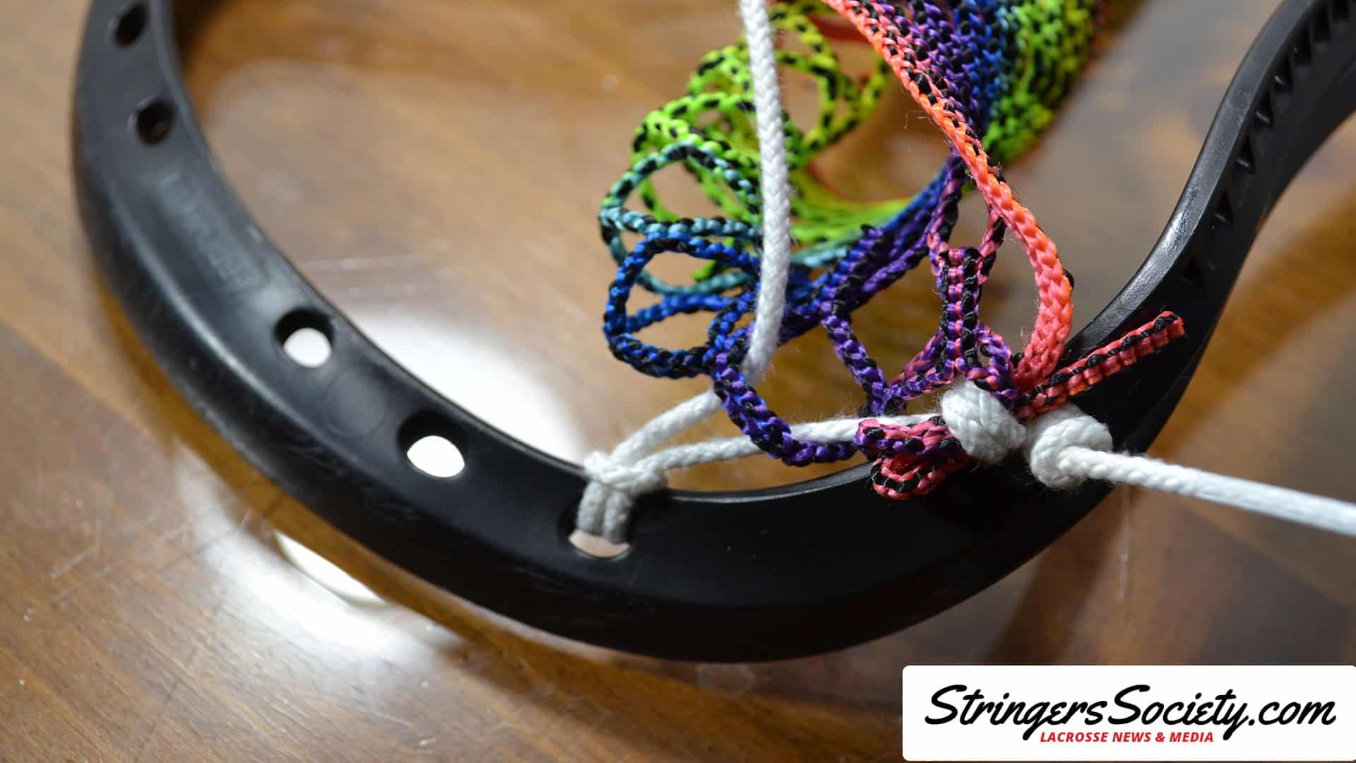 How to String a Women's Lacrosse Head womens lacrosse topstring step 6